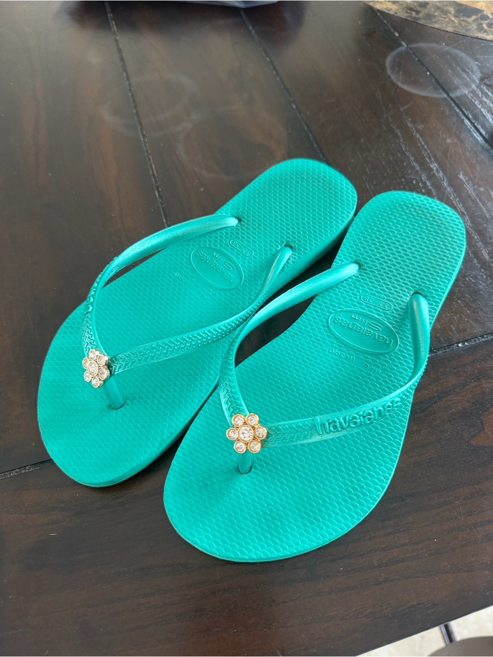 Havaianas Women's Turquoise Flip Flops with Gold Flower Charms